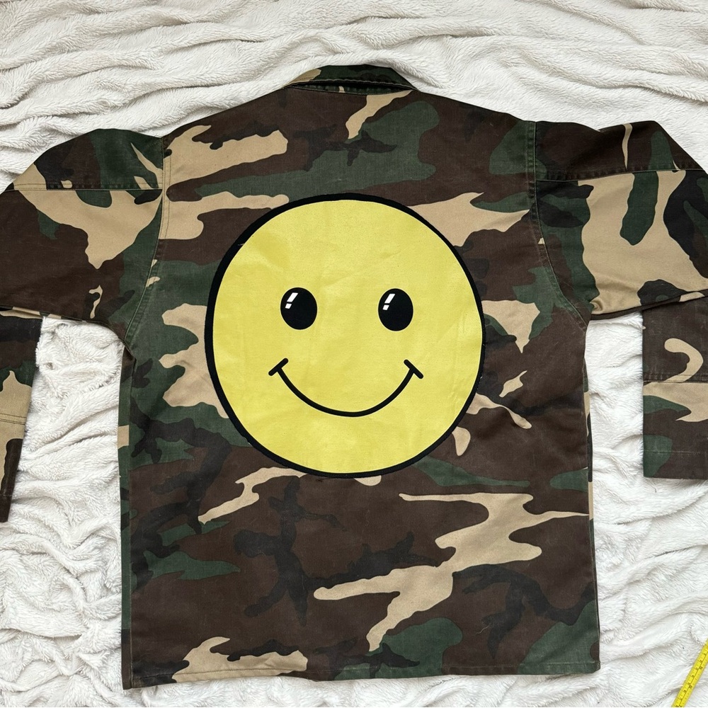 Army print jacket with smiley face